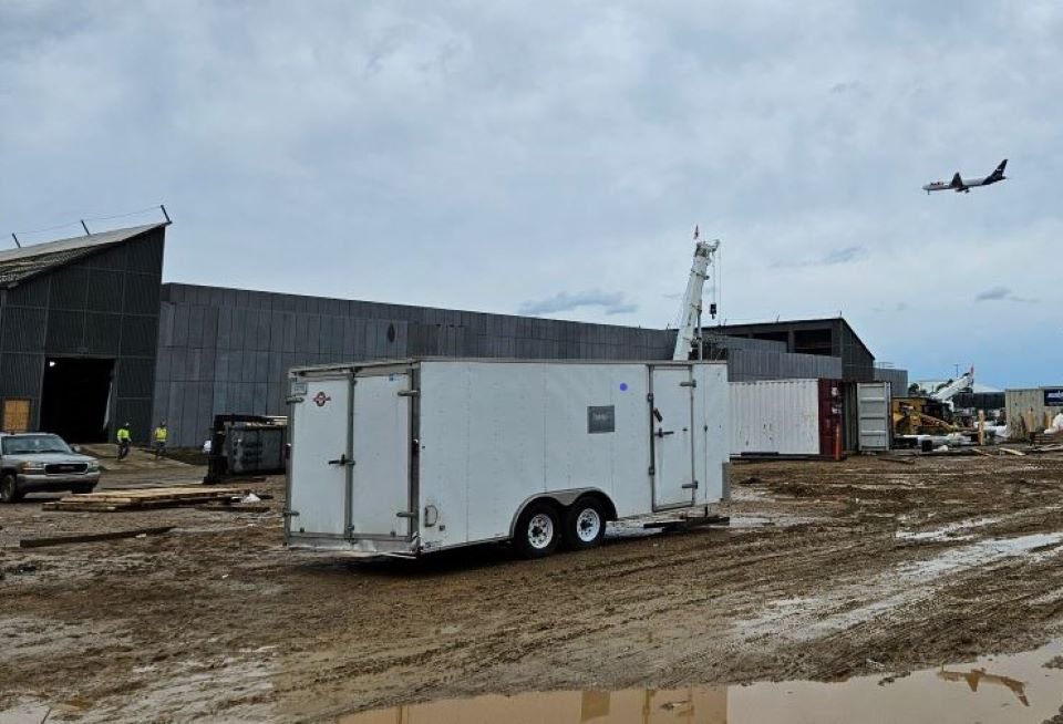  FedEx freight plane in flight on approach to the Super Hub enjoys aerial view of Central Power Plant construction progress. 
